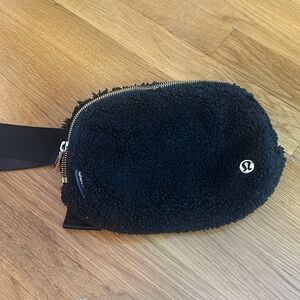 Lululemon belt bag black with gold details